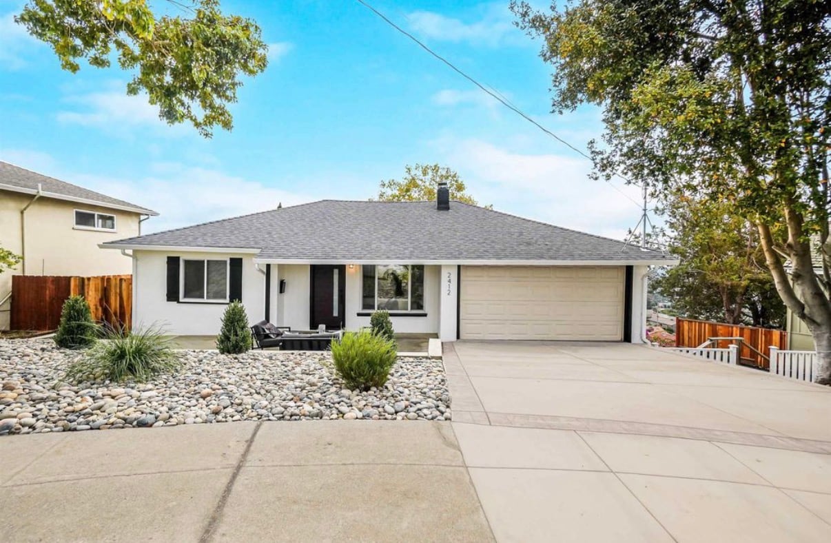 Renovated ranch home with river-rock landscaping