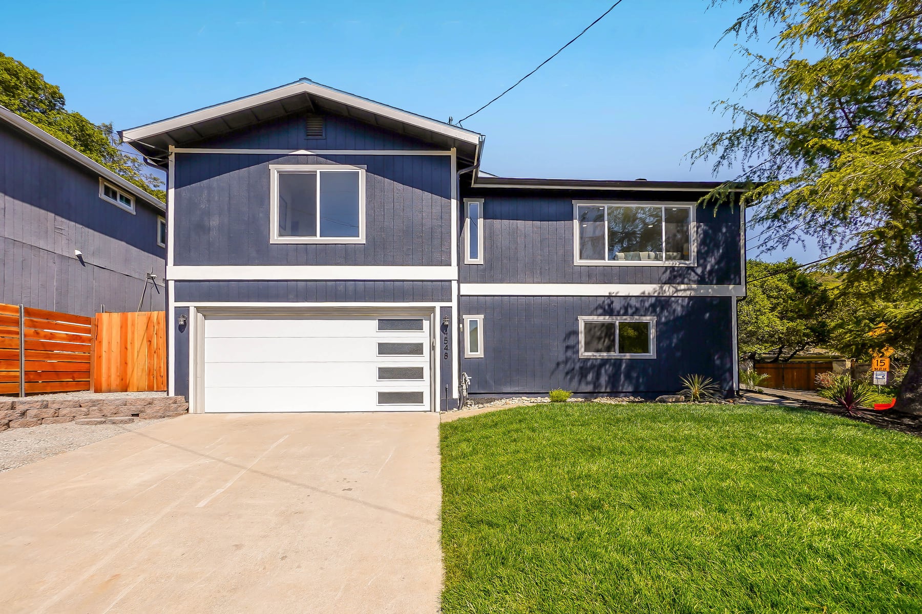 Navy modern split-level home after renovation